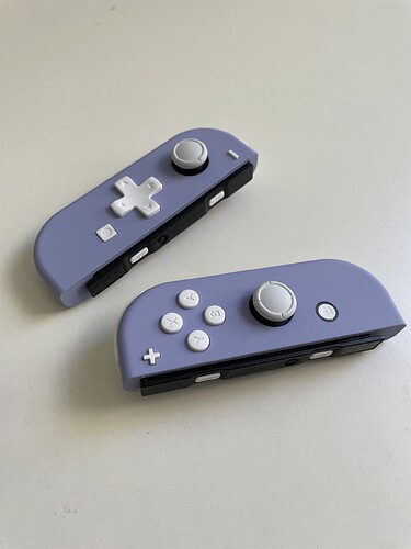 Violet d-pad Joy-Cons detached from Nintendo Switch