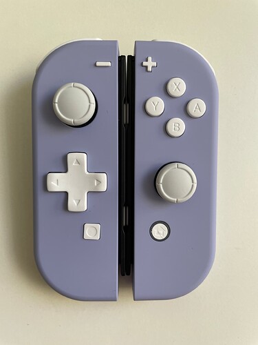 Violet d-pad joy-cons side by side